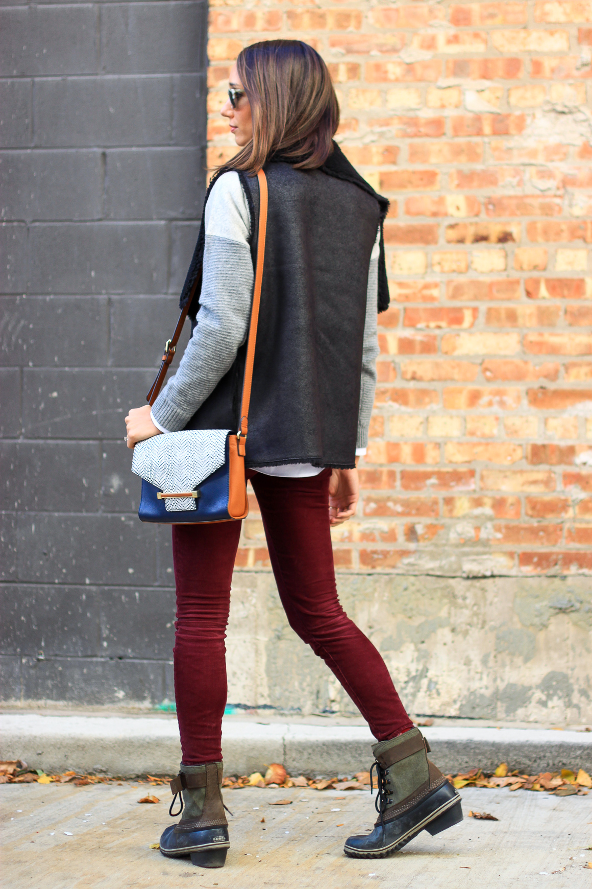 faux fur vest, colorblock sweater, skinny corduroys, sorel boots, women's fashion, the fox and she