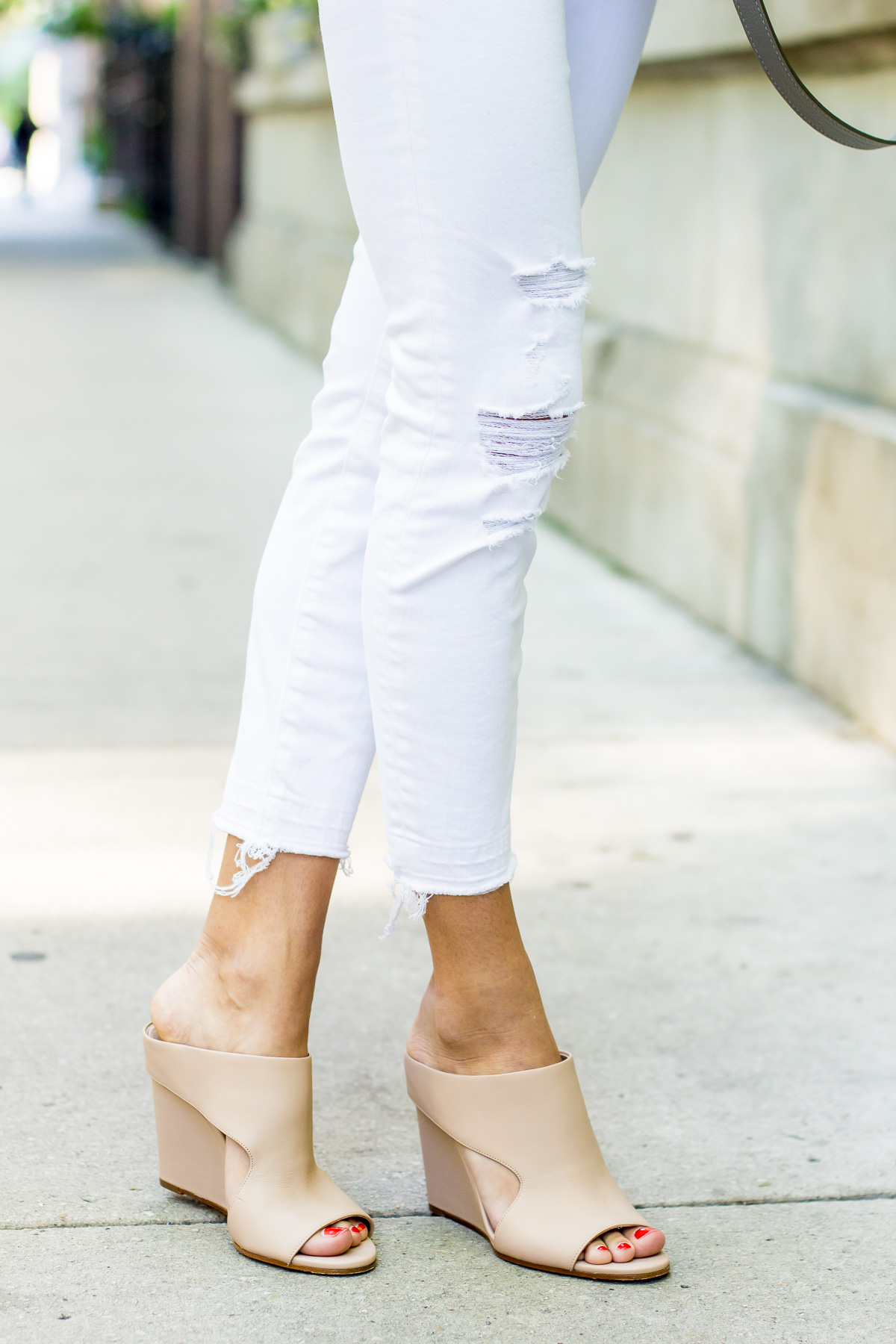 ripped white jeans and mules — via @TheFoxandShe