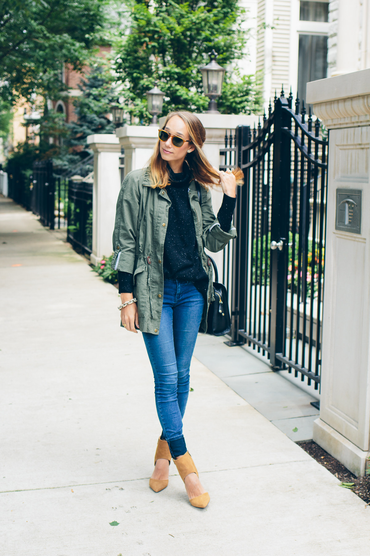 cashmere sweater, skinny jeans, military jacket and heels — via @TheFoxandShe