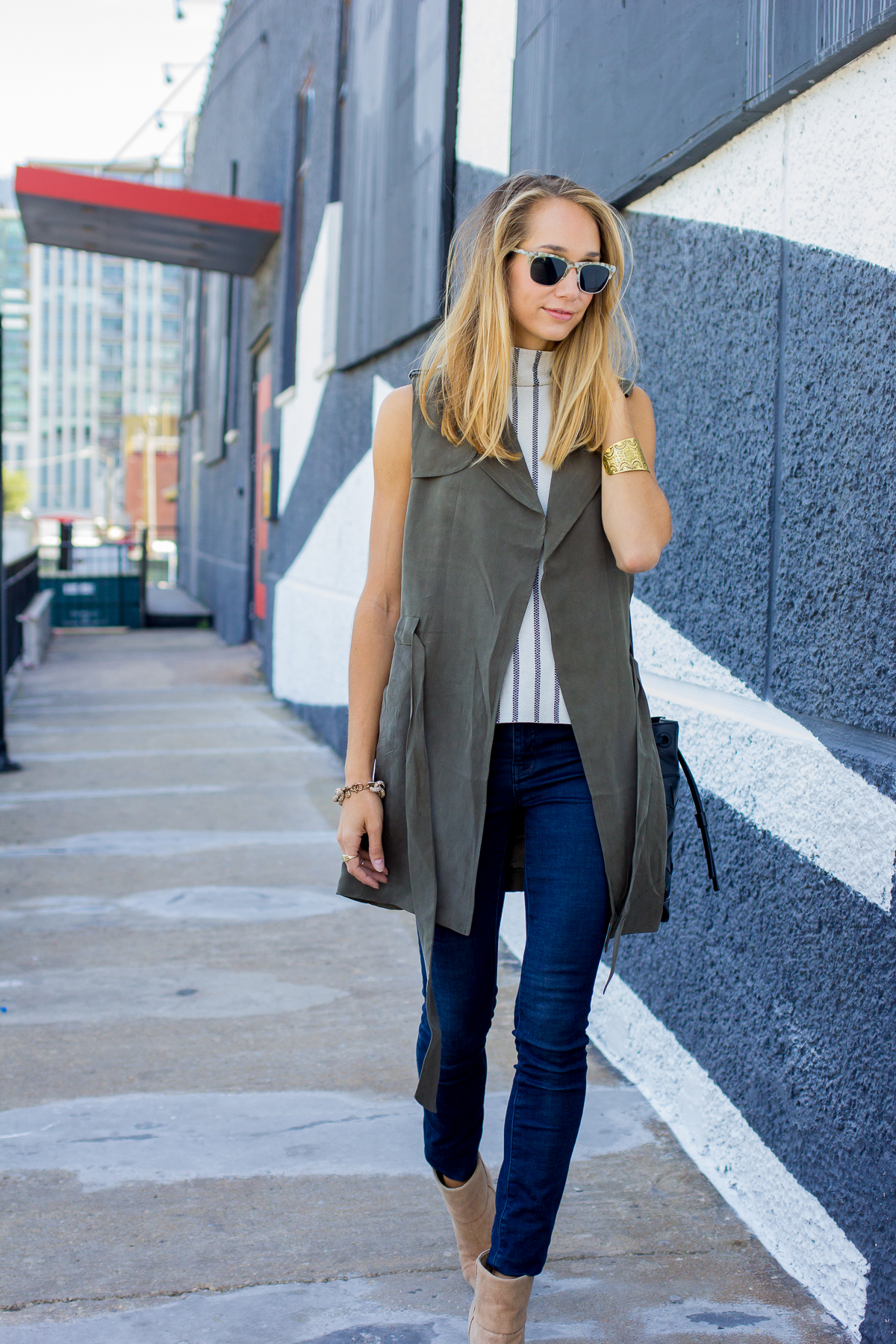 duster vest, striped shirt and skinny jeans, fall fashion — via @TheFoxandShe