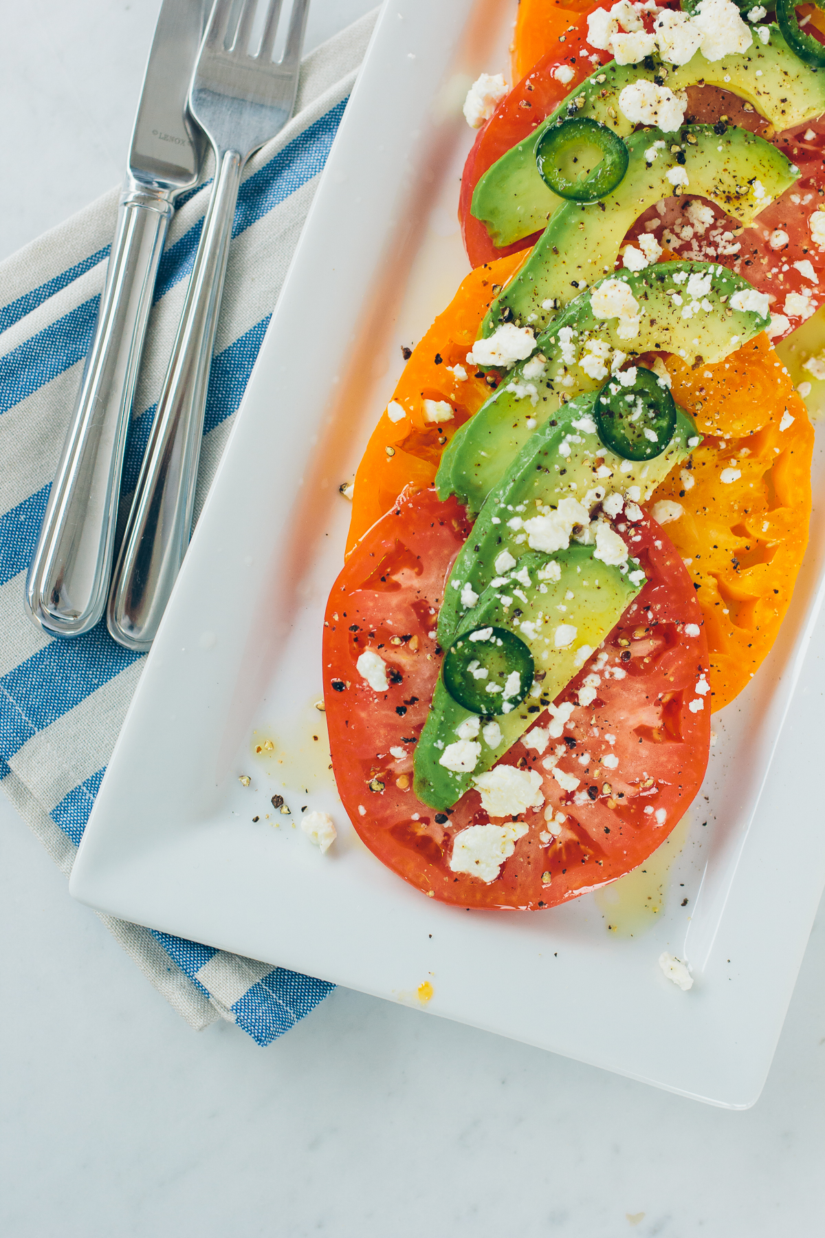 Heirloom Tomato Salad with Avocado — via @TheFoxandShe