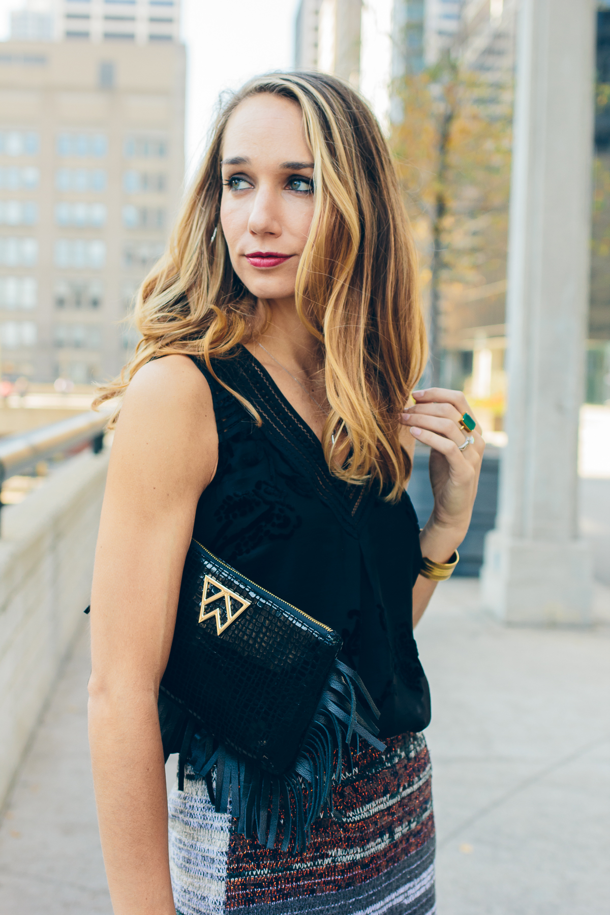 velvet top, fringed clutch, holiday outfit — via @TheFoxandShe