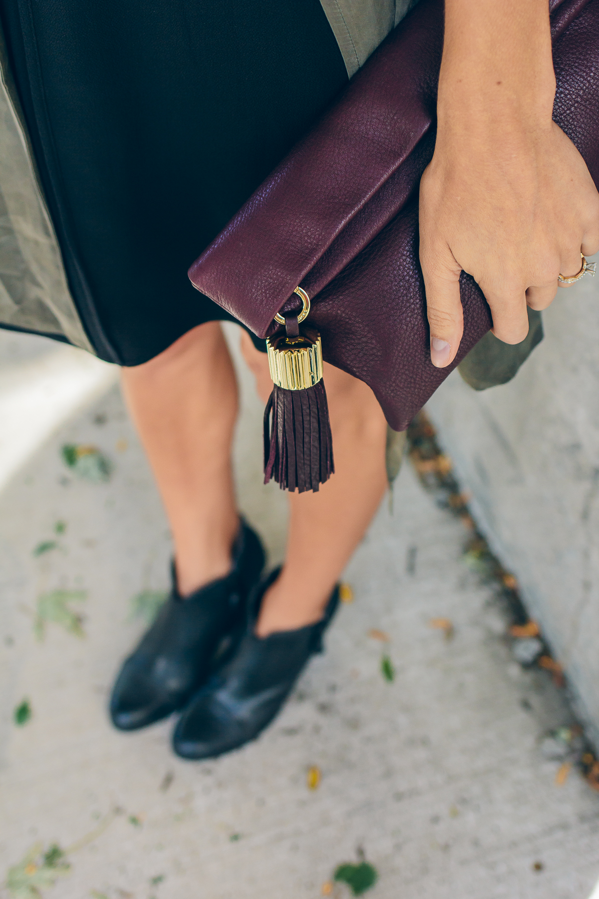 trench vest, wool hat, carmen clutch with tassel detail — via @TheFoxandShe