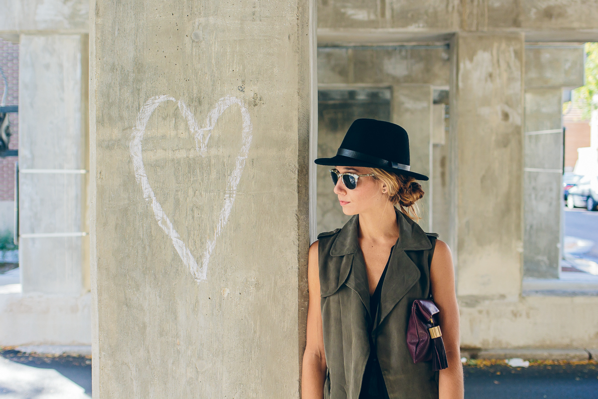 trench vest, wool hat, carmen clutch with tassel detail — via @TheFoxandShe