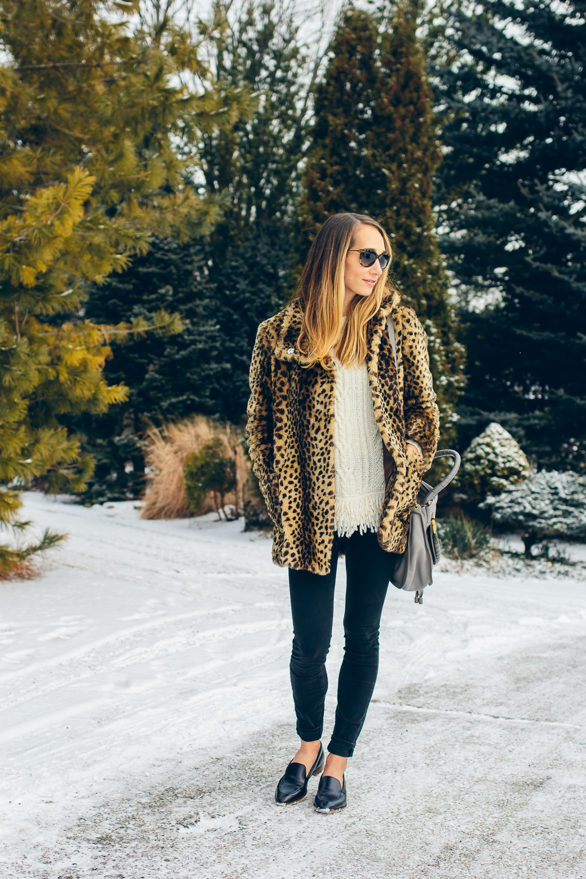 leopard coat, fringe sweater, black skinny jeans, pointy toe loafers — via @TheFoxandShe