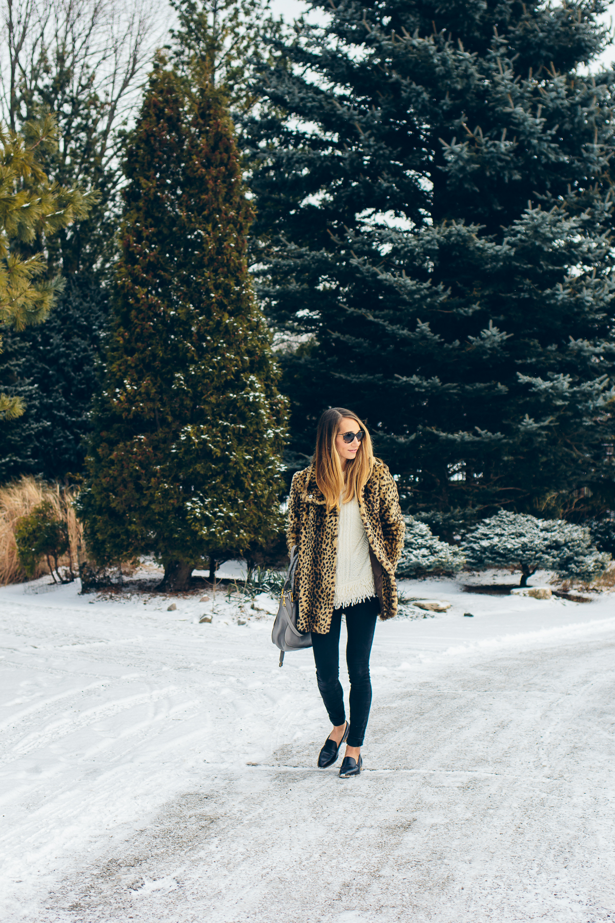 leopard coat, fringe sweater, black skinny jeans, pointy toe loafers — via @TheFoxandShe