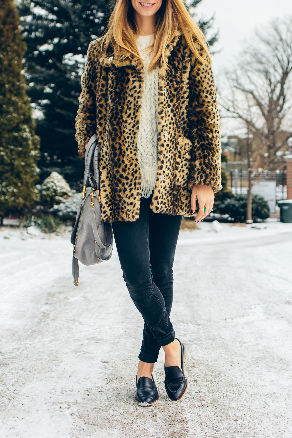 leopard coat, fringe sweater, black skinny jeans, pointy toe loafers — via @TheFoxandShe