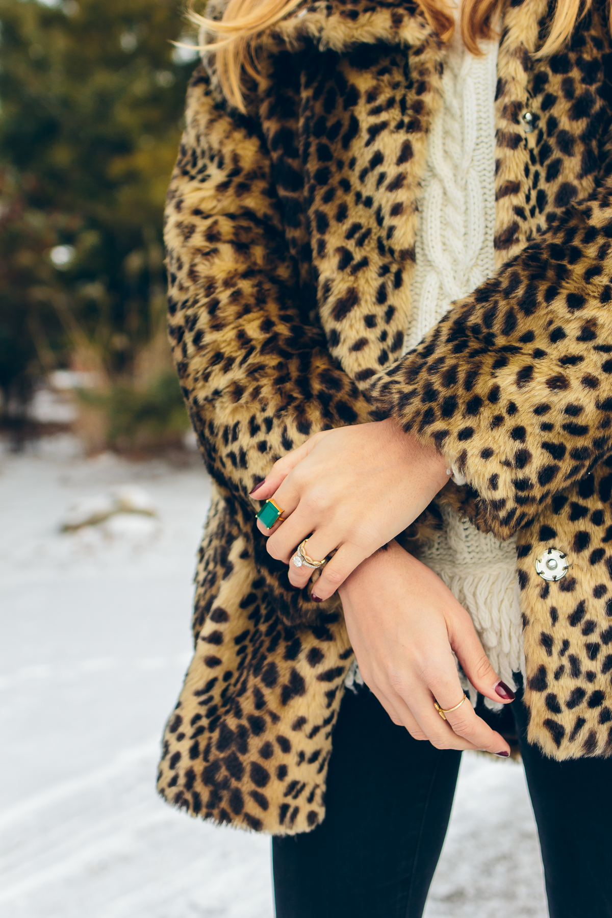 leopard coat, fringe sweater, black skinny jeans, emerald cut cocktail ring — via @TheFoxandShe