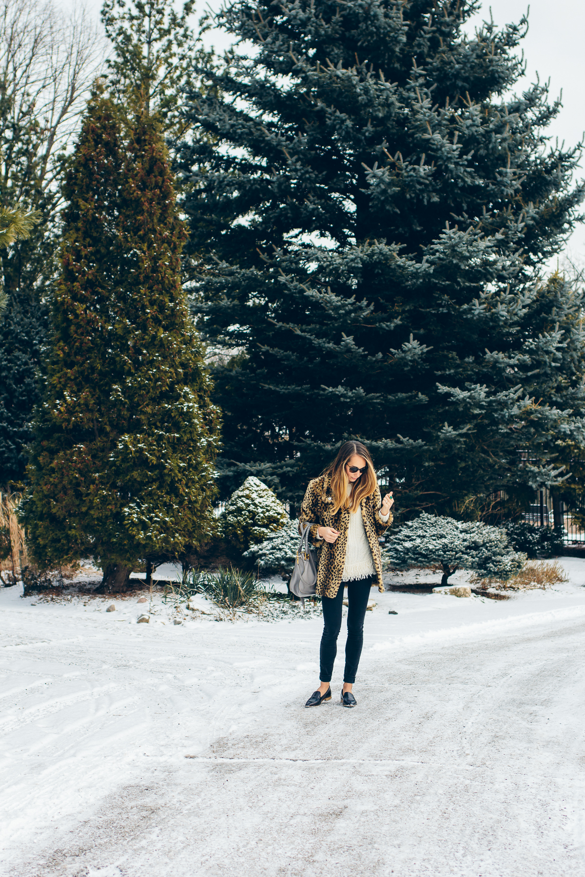 leopard coat, fringe sweater, black skinny jeans, pointy toe loafers — via @TheFoxandShe