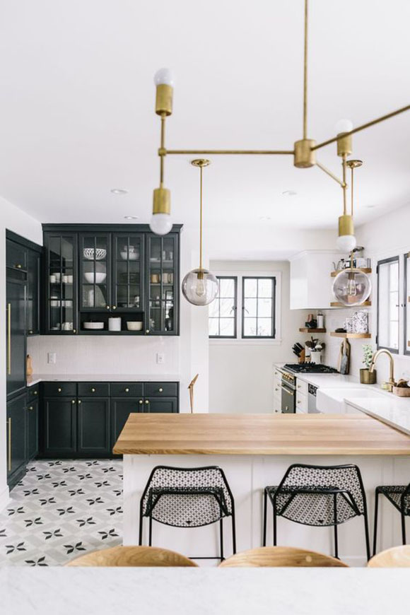black and white kitchen with gold finishings