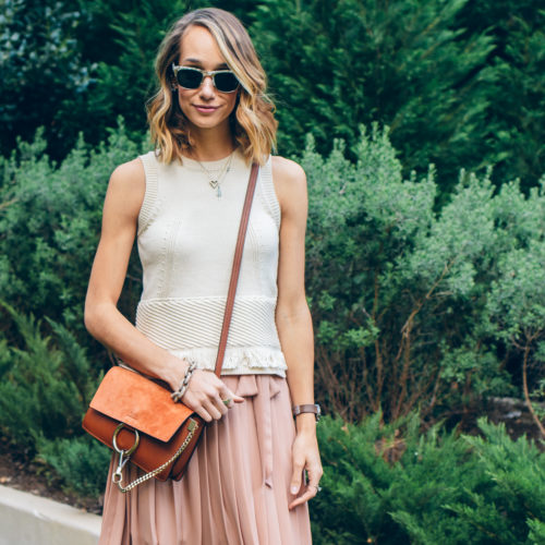 pleated skirt and fringe sweater tank — via @TheFoxandShe