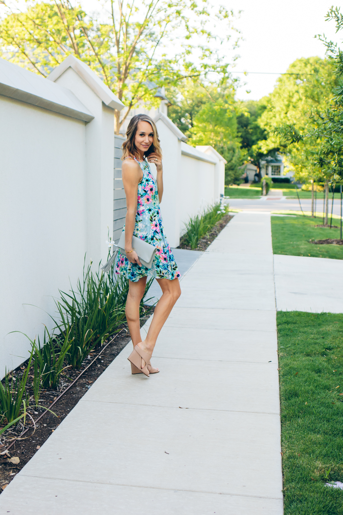 floral print dress, mules, fringe clutch — via @TheFoxandShe