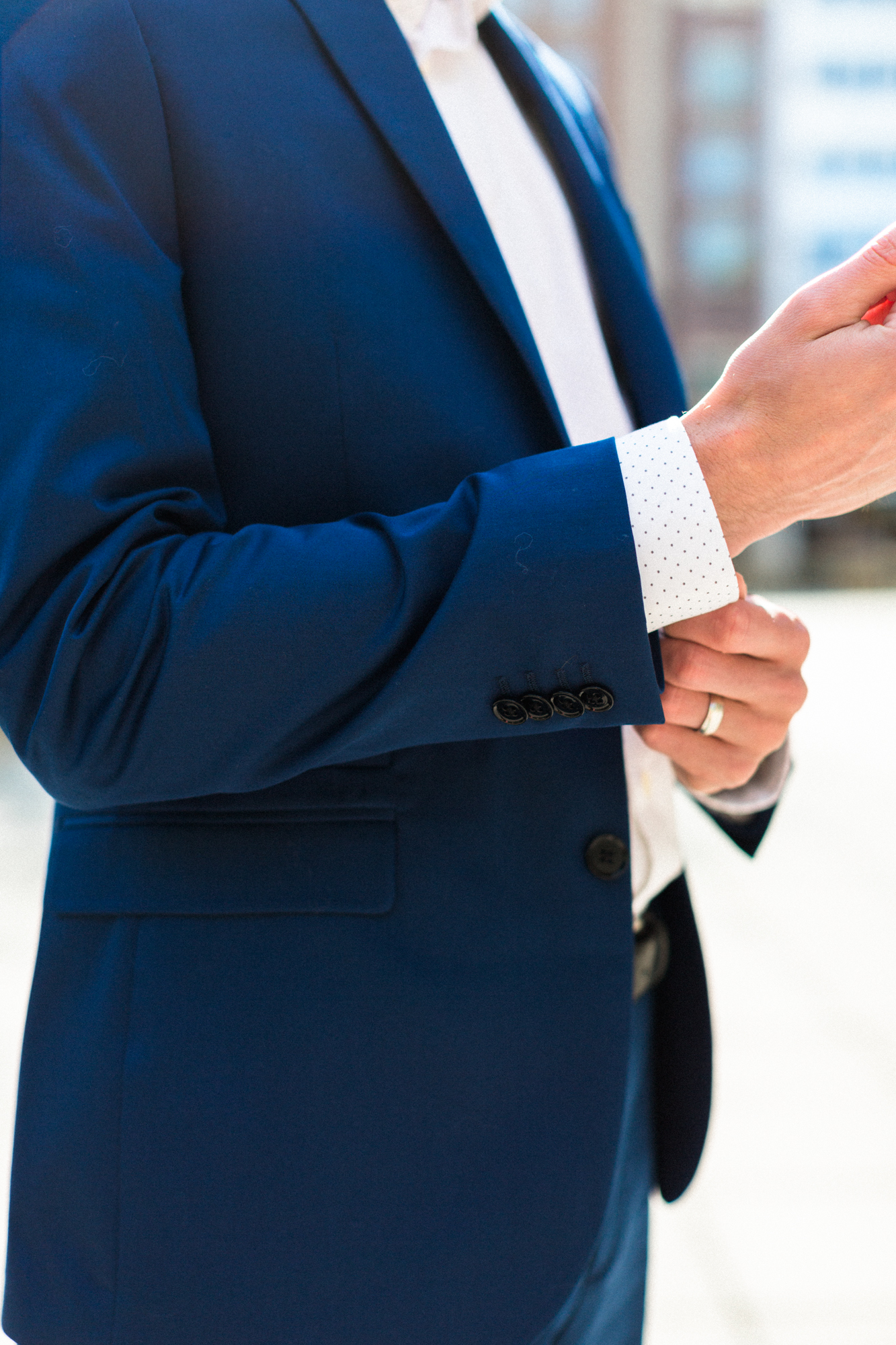 blue suit and dot print shirt