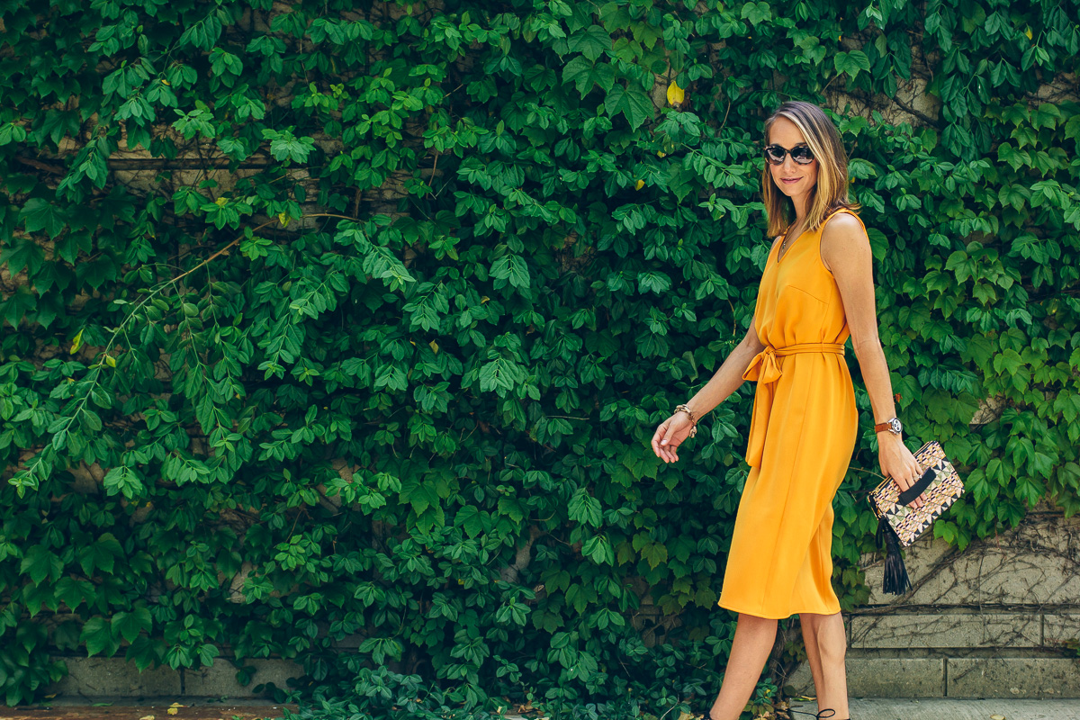 yellow dress and straw clutch