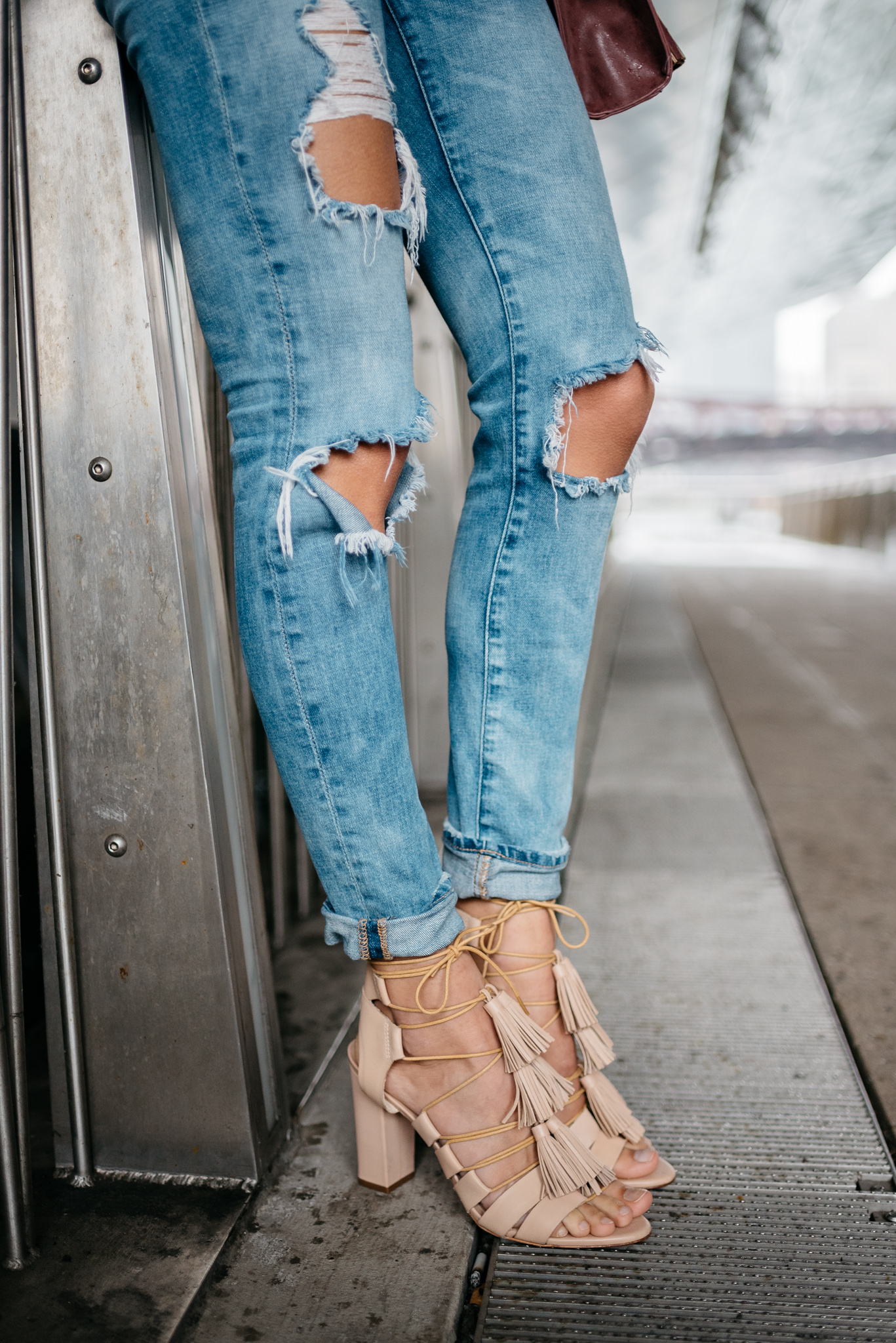ripped jeans lace up heels
