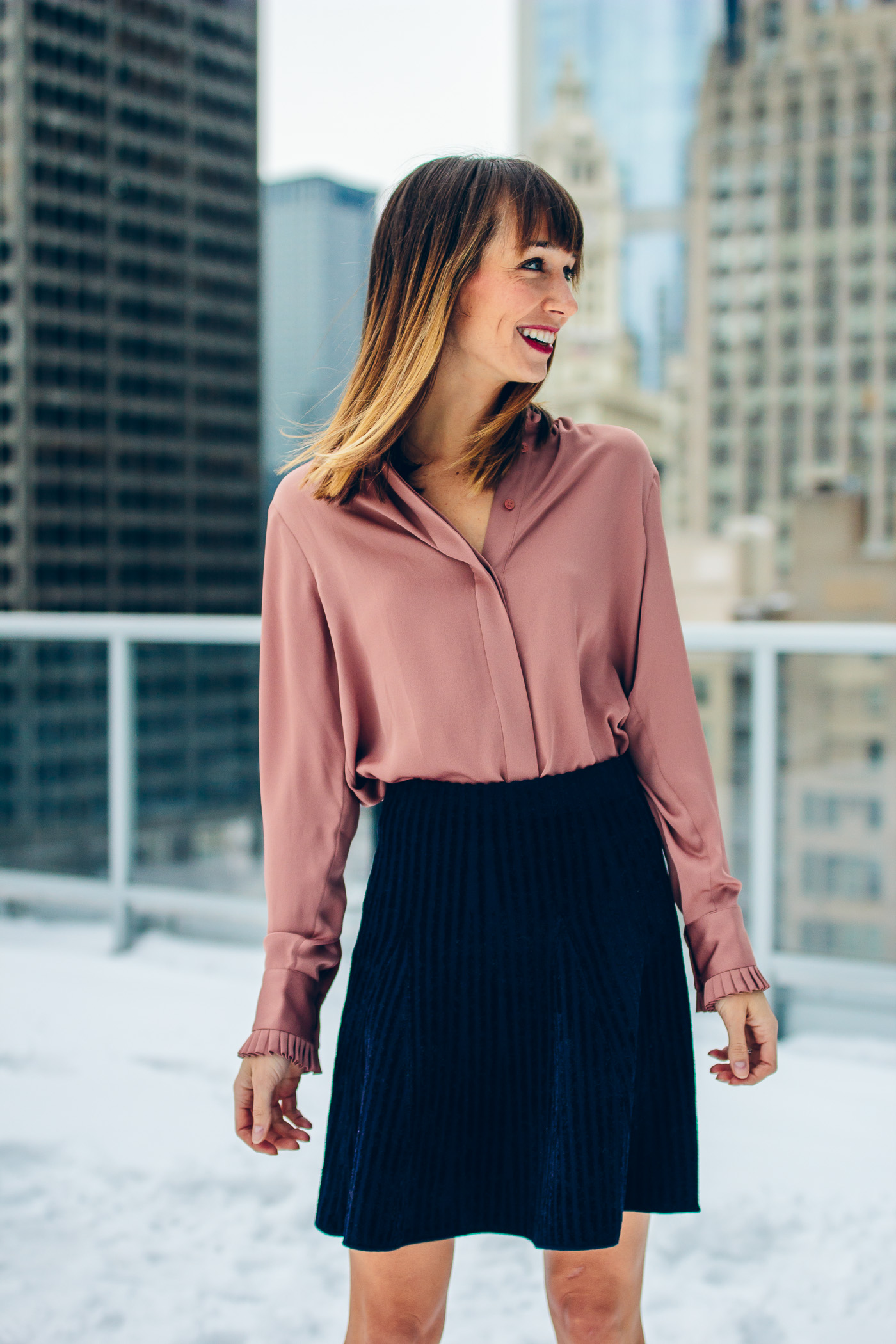 Blair Staky of The Fox & She wears a blush top and navy skirt