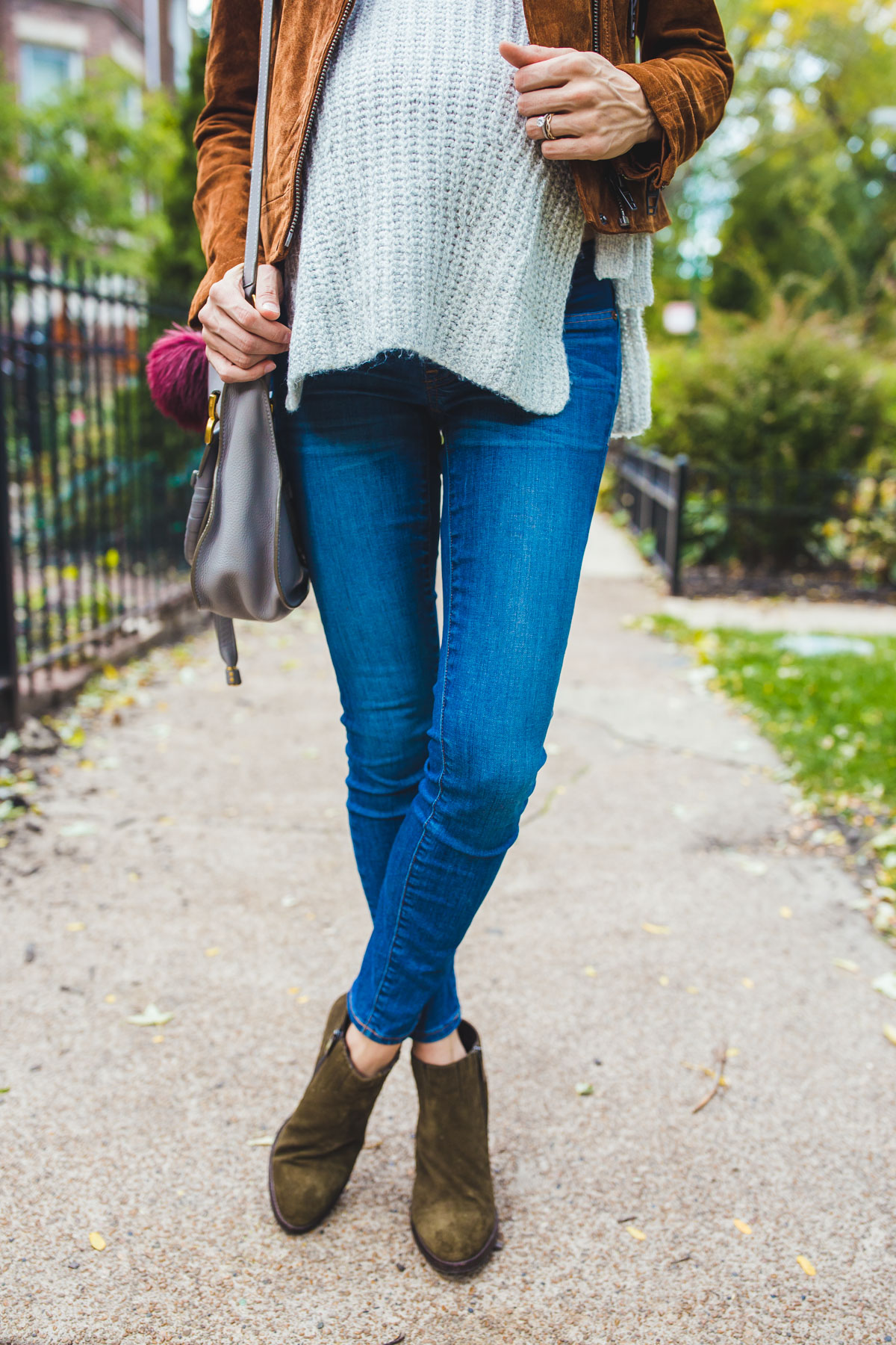 jeans with a grey sweater tank and green booties