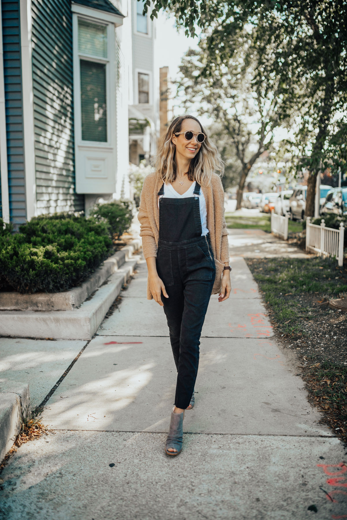 white tee and overalls