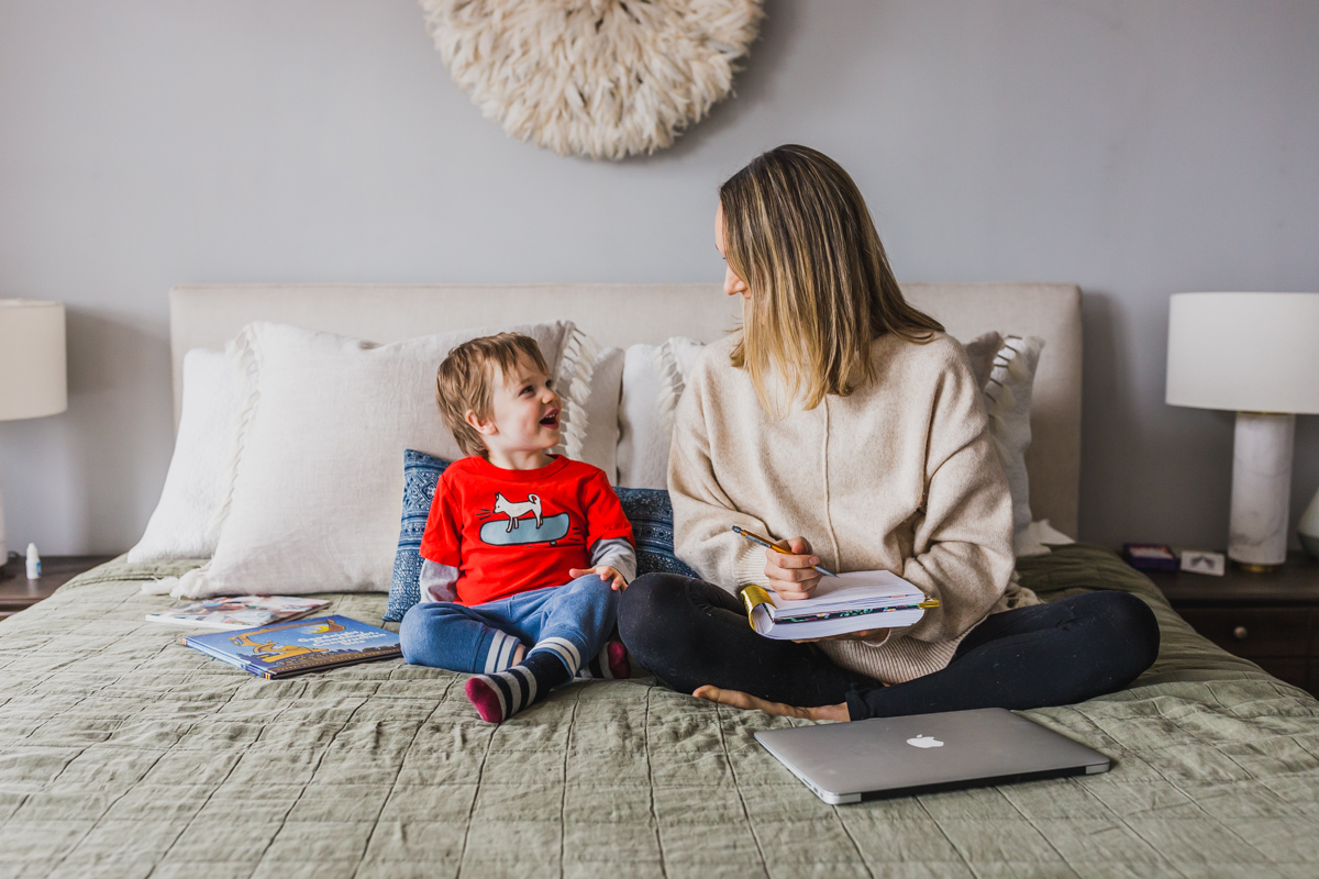 I'm sharing my productive day routine and work from home tips for moms with toddlers. This work at home toddler mom schedule highlights how to block schedule time, easy indoor toddler activities to burn energy, our screen times rules and how to have a productive nap times. Balancing mom life with a job at home is tough, but not impossible, click through for parenting hacks and my work from home schedule. #workfromhomemom #toddleractivities