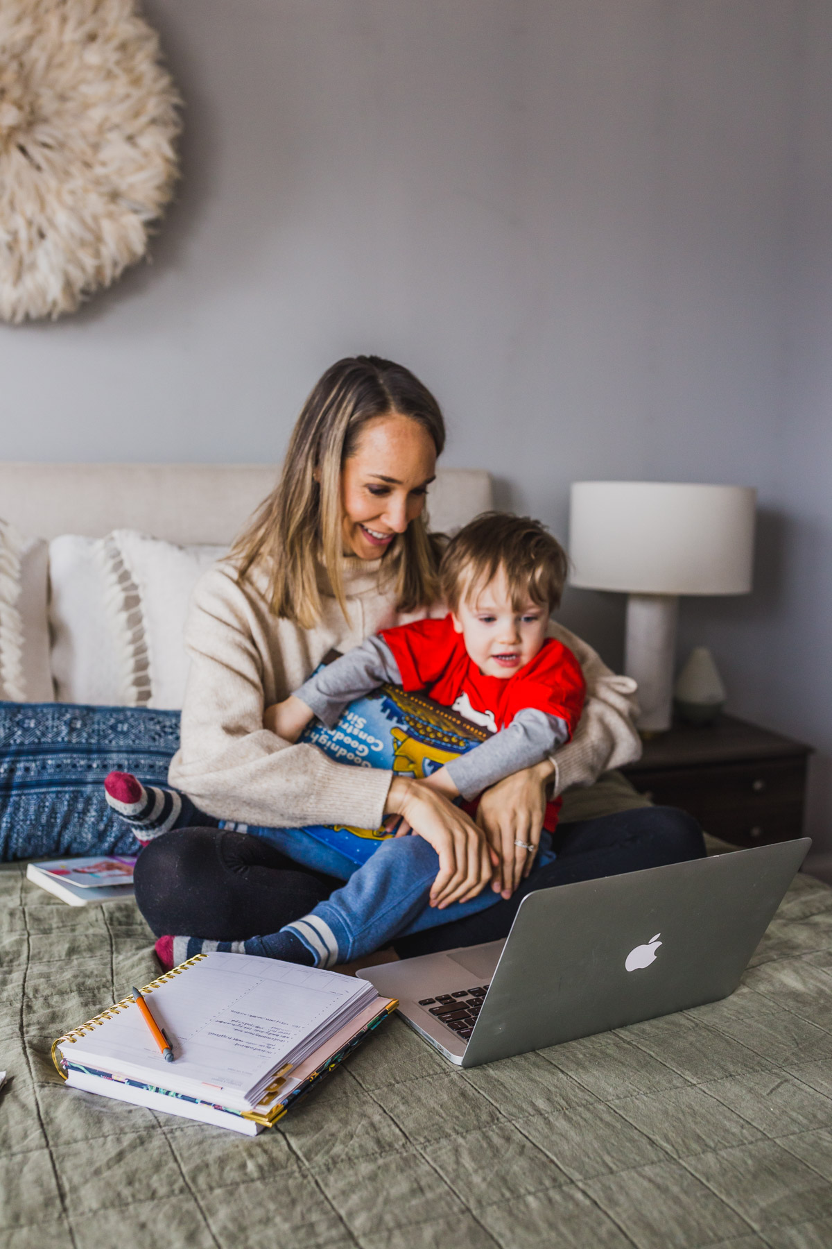 I'm sharing my productive day routine and work from home tips for moms with toddlers. This work at home toddler mom schedule highlights how to block schedule time, easy indoor toddler activities to burn energy, our screen times rules and how to have a productive nap times. Balancing mom life with a job at home is tough, but not impossible, click through for parenting hacks and my work from home schedule. #workfromhomemom #toddleractivities