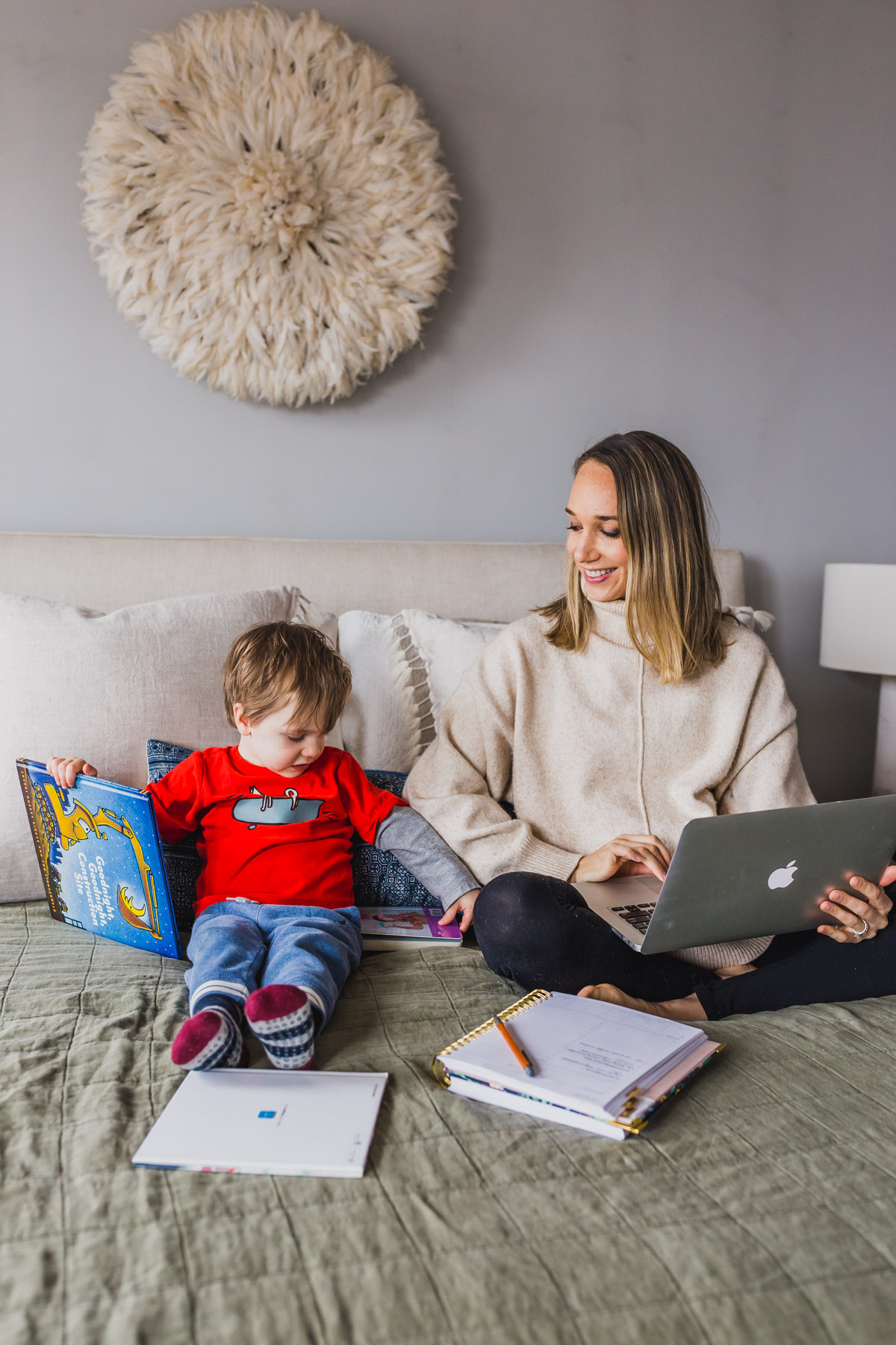 I'm sharing my productive day routine and work from home tips for moms with toddlers. This work at home toddler mom schedule highlights how to block schedule time, easy indoor toddler activities to burn energy, our screen times rules and how to have a productive nap times. Balancing mom life with a job at home is tough, but not impossible, click through for parenting hacks and my work from home schedule. #workfromhomemom #toddleractivities