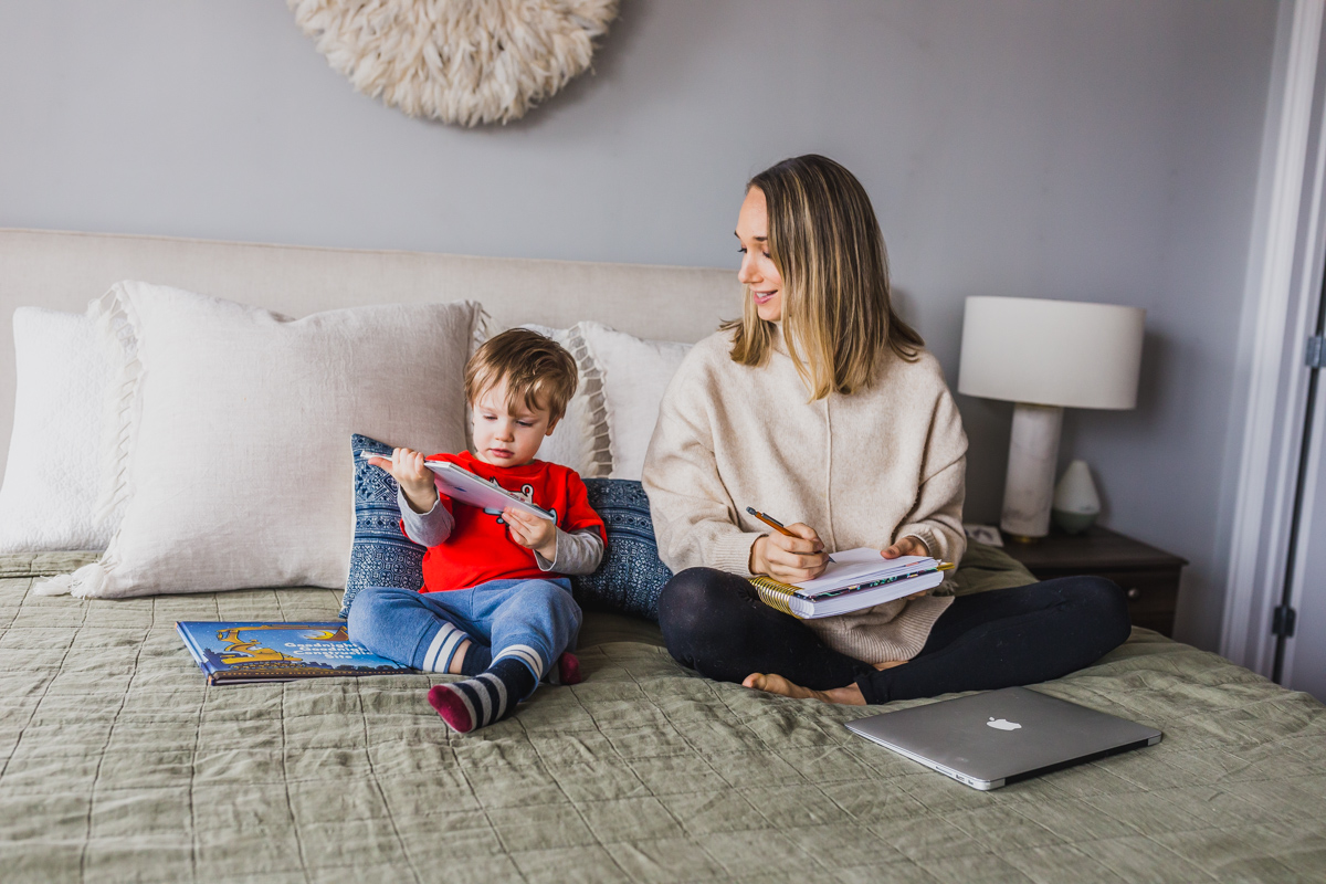 I'm sharing my productive day routine and work from home tips for moms with toddlers. This work at home toddler mom schedule highlights how to block schedule time, easy indoor toddler activities to burn energy, our screen times rules and how to have a productive nap times. Balancing mom life with a job at home is tough, but not impossible, click through for parenting hacks and my work from home schedule. #workfromhomemom #toddleractivities