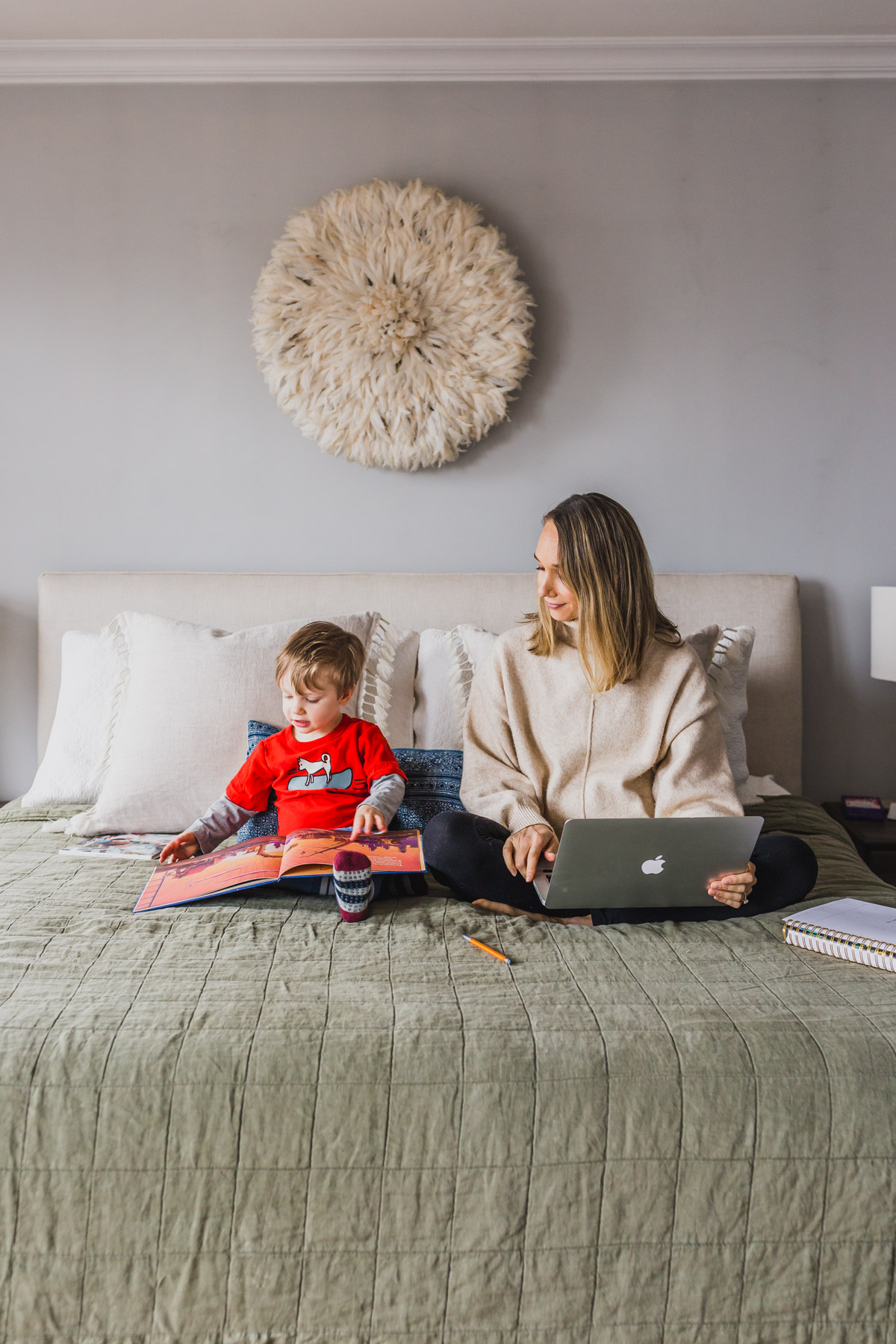 I'm sharing my productive day routine and work from home tips for moms with toddlers. This work at home toddler mom schedule highlights how to block schedule time, easy indoor toddler activities to burn energy, our screen times rules and how to have a productive nap times. Balancing mom life with a job at home is tough, but not impossible, click through for parenting hacks and my work from home schedule. #workfromhomemom #toddleractivities