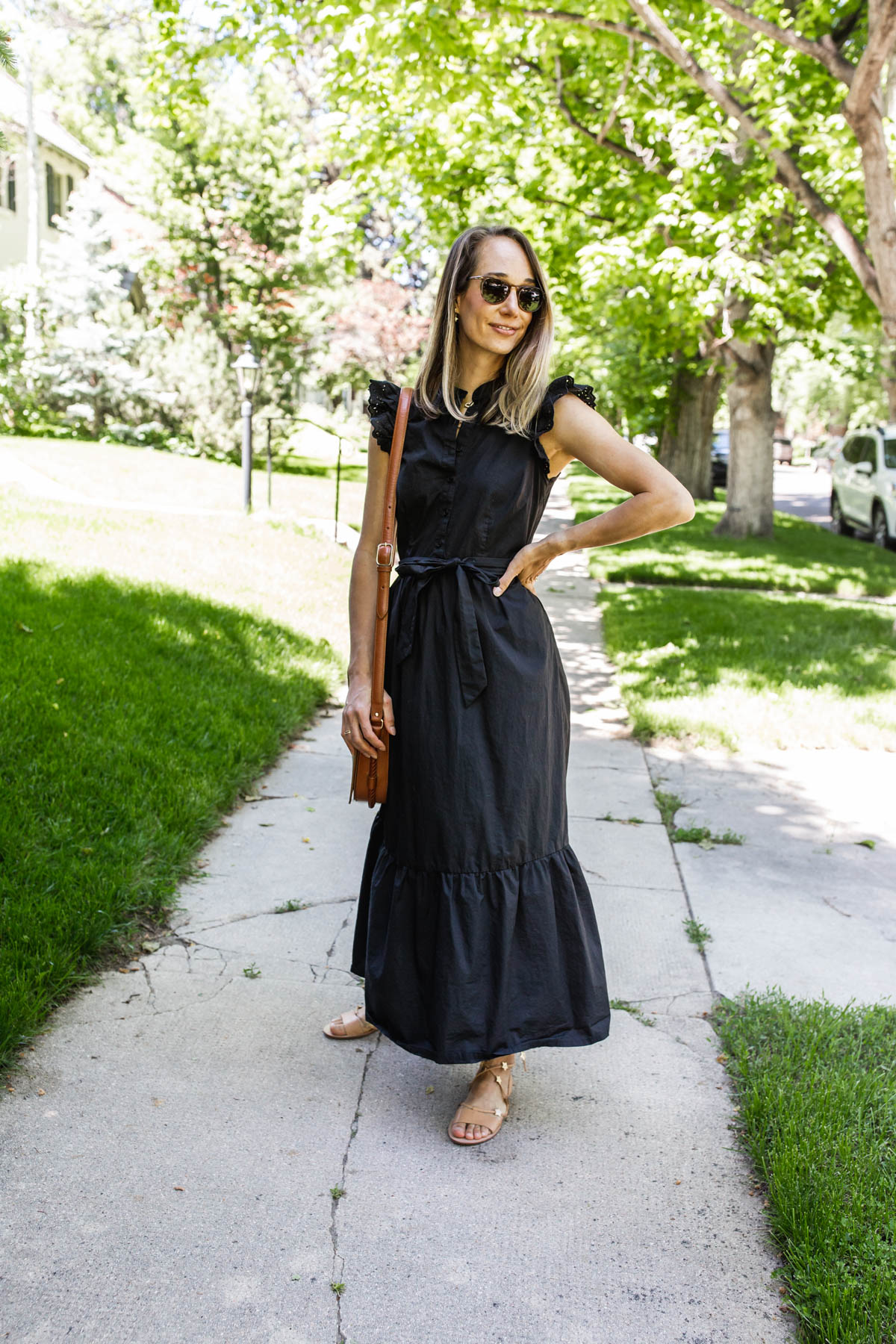 woman outdoors and wearing black dress for $40 Dresses for Summer