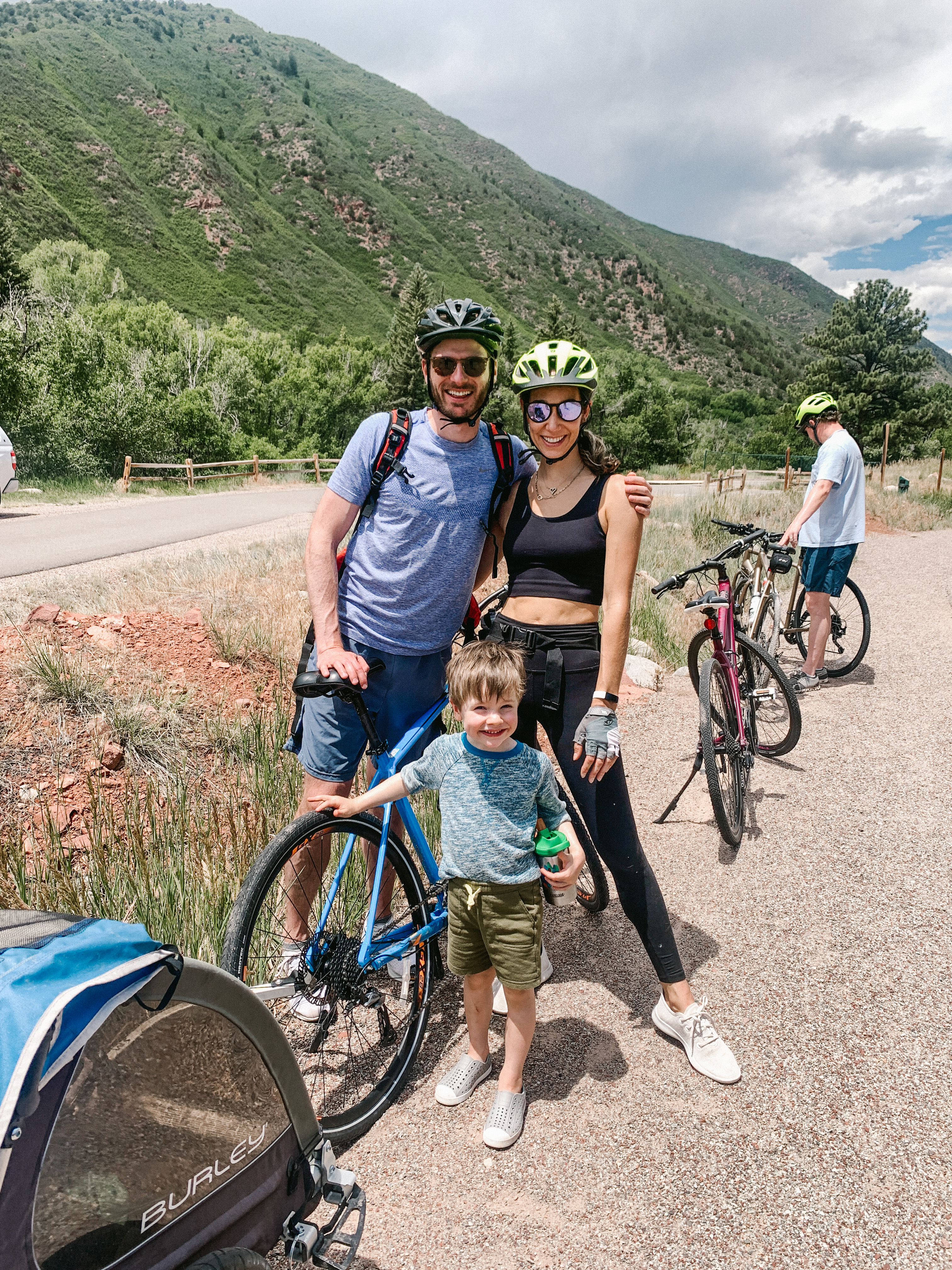 man, woman, and childing biking outdoors man, woman, and childing biking outdoors