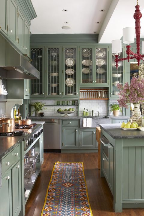 kitchen inspiration with green cabinets, black countertops