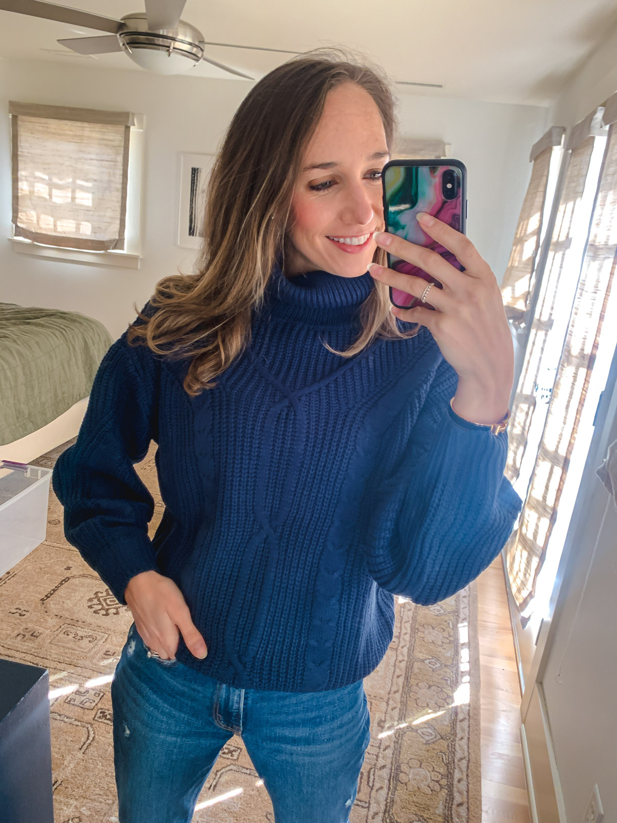 woman taking selfie and wearing cable Knit Turtleneck Sweater