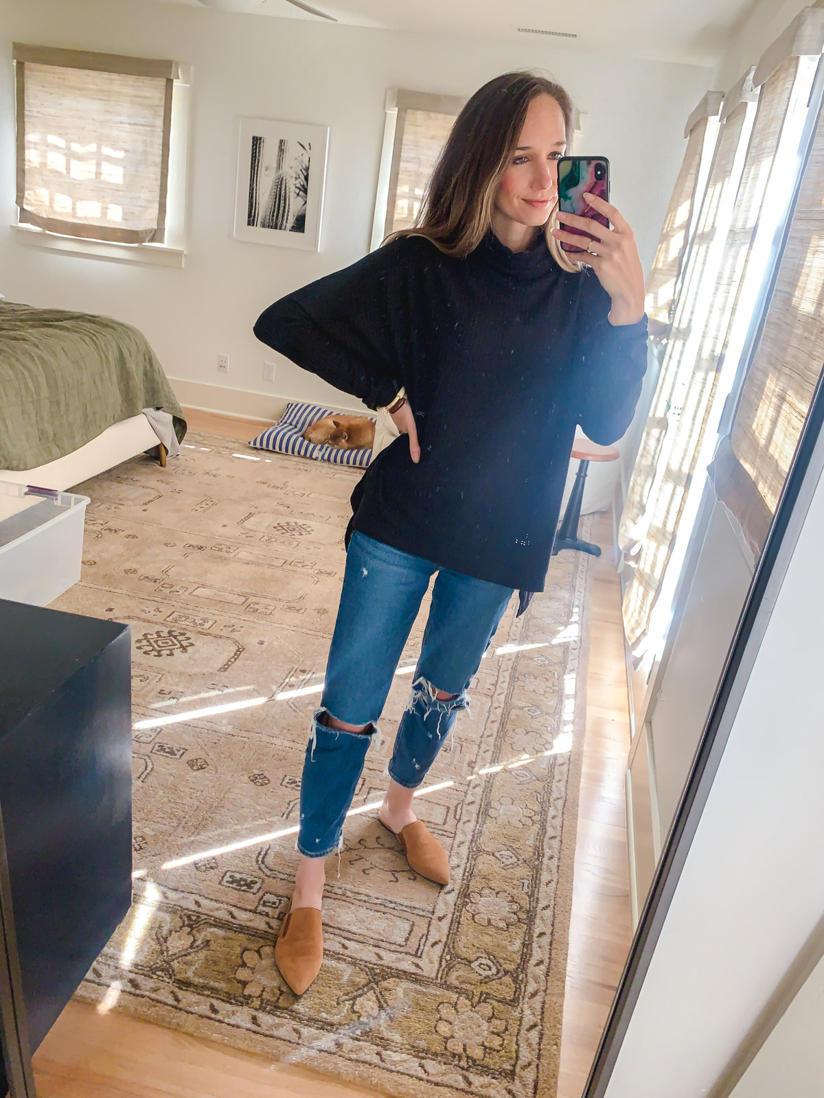 woman taking a selfie and wearing Slouchy Sweater in black 