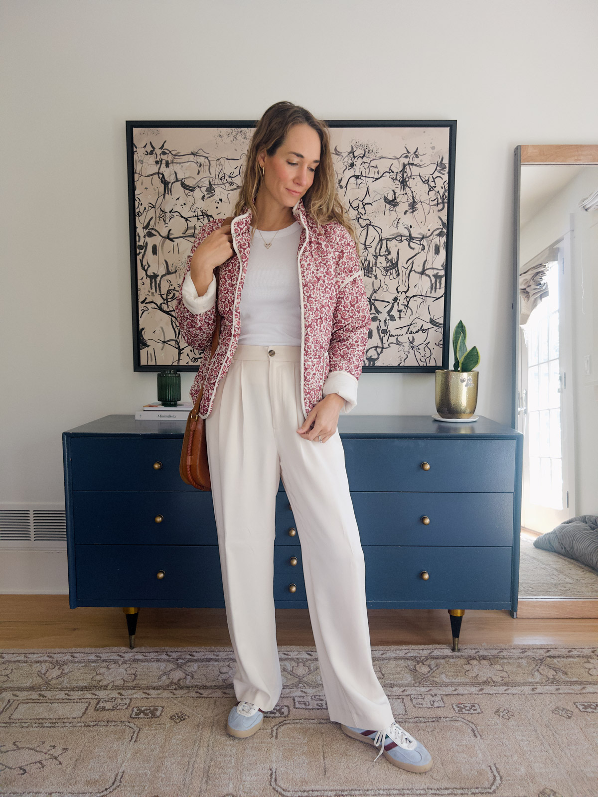 white pants outfit with quilted jacket