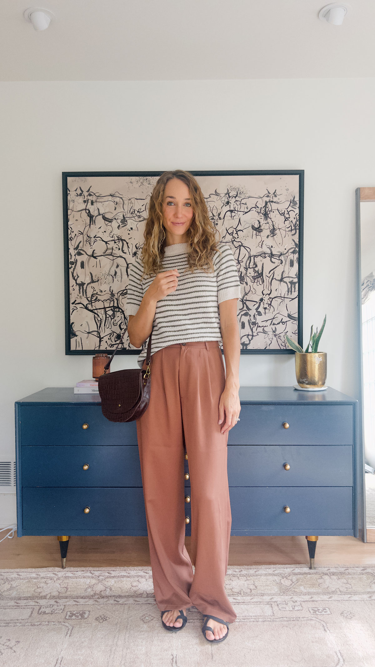 green striped shirt and brown pants