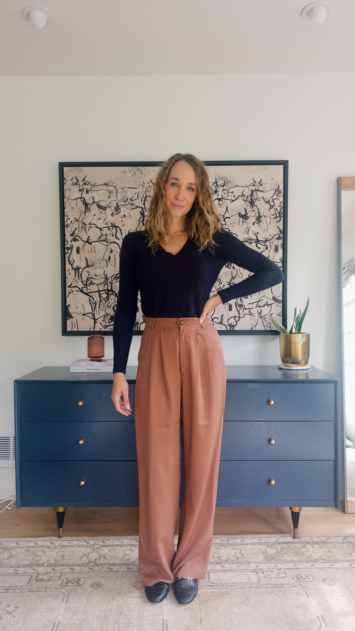 navy sweater and brown pants outfit